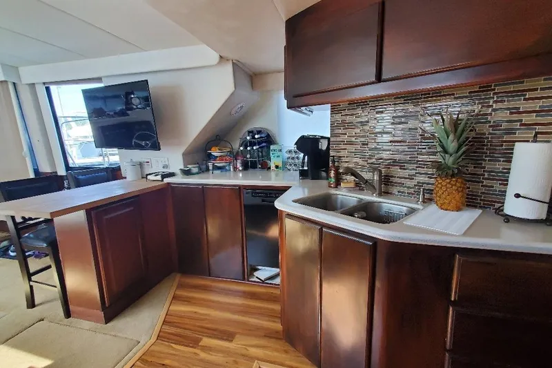 Slide: The Image of Luxurious kitchen interior of 1992 Bluewater 54 Coastal Cruiser yacht with modern amenities. - 3