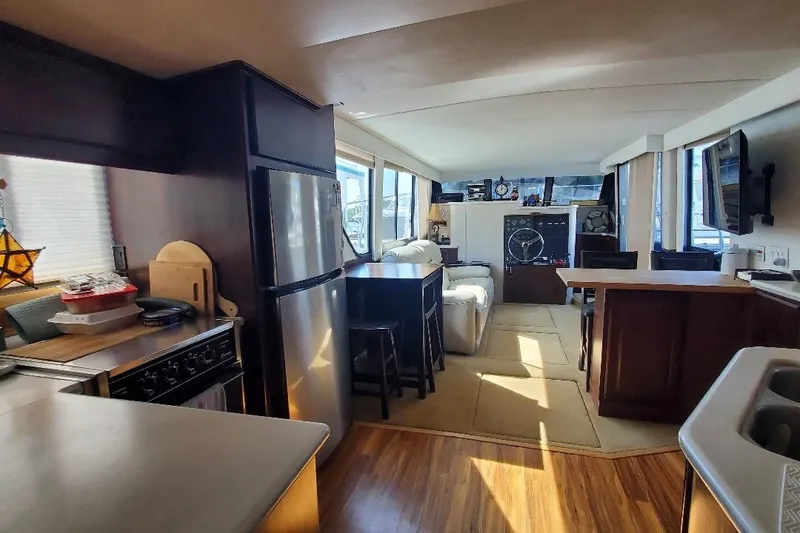 Slide: The Image of Interior of 1992 Bluewater 54 Coastal Cruiser yacht with modern kitchen and living area. - 5