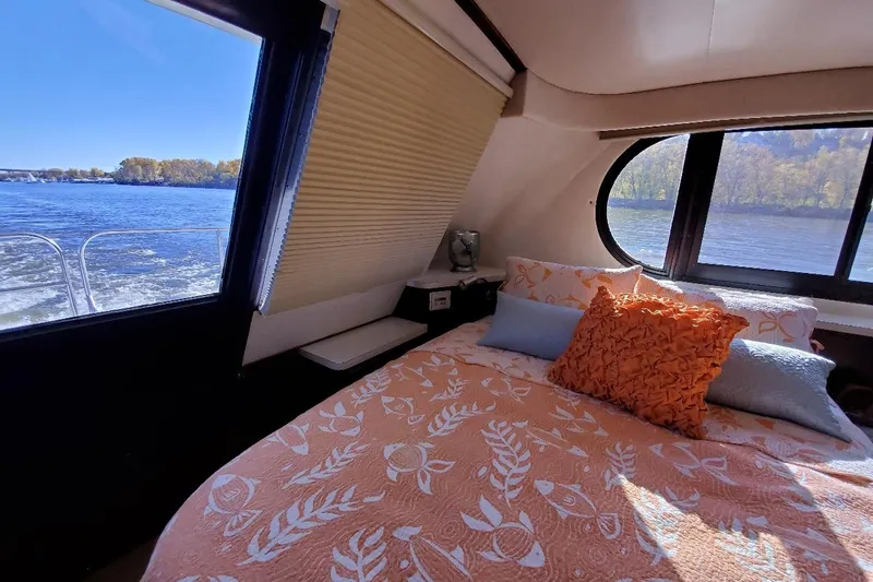 Slide: The Image of Cozy bedroom in 1992 Bluewater 54 Coastal Cruiser with scenic water views. - 6