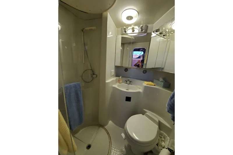 Slide: The Image of Bathroom interior of 1992 Bluewater 54 Coastal Cruiser yacht, featuring shower and toilet. - 9