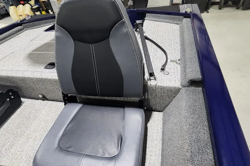 Slide: The Image of 2021 Tracker Pro 170 boat interior with gray seating and carpeted flooring. - 4