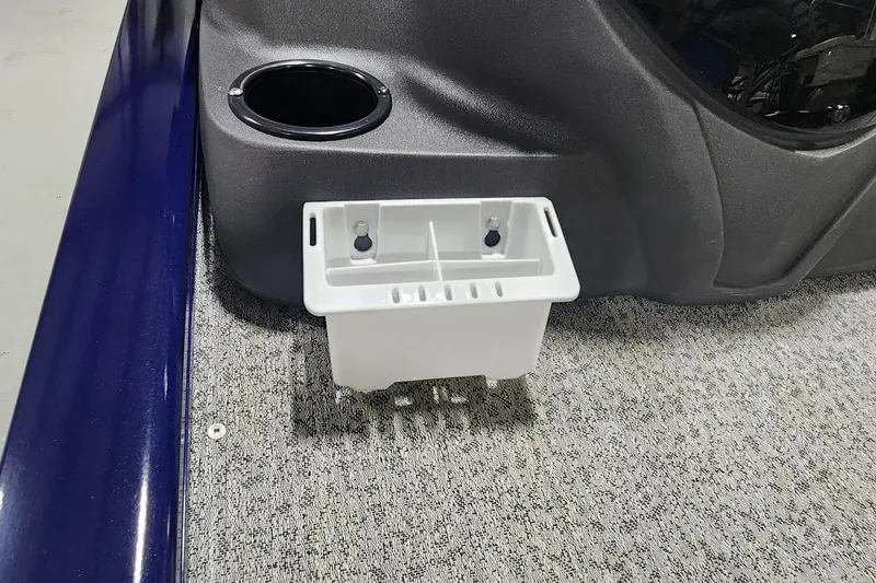 Slide: The Image of 2021 Tracker Pro 170 boat interior with cup holder and storage compartment. - 8