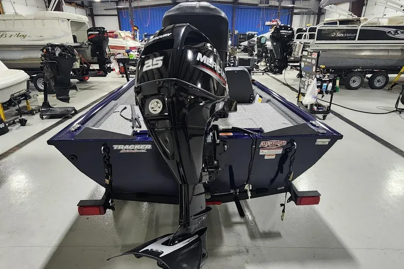 Slide: The Image of 2021 Tracker Pro 170 boat with Mercury 25 engine in showroom. - 9