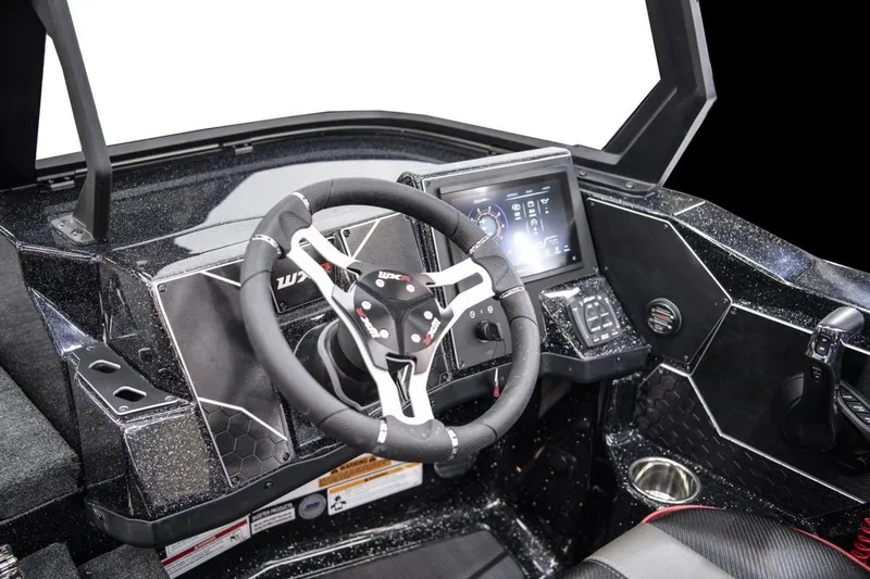 Slide: The Image of Manufacturer Provided Image: 2026 Skeeter WXR2260 boat cockpit with steering wheel and digital display. - 11