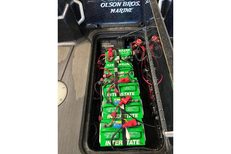 Slide: The Image of Battery compartment of 2025 Skeeter WXR2260 boat with Interstate batteries and wiring. - 6