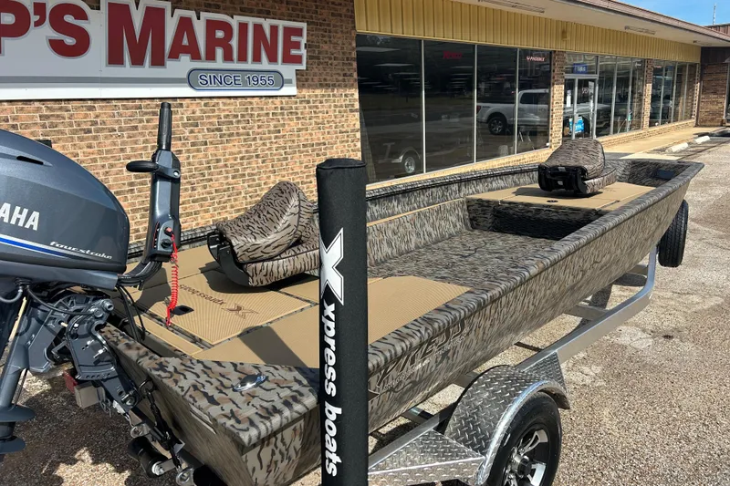 Slide: The Image of 2026 Xpress HD16DBX boat with Yamaha motor at dealership. - 2