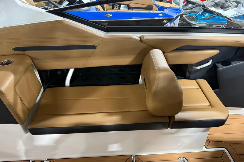 Slide: The Image of 2026 Yamaha Boats 295SD interior with tan leather seating and modern design. - 13