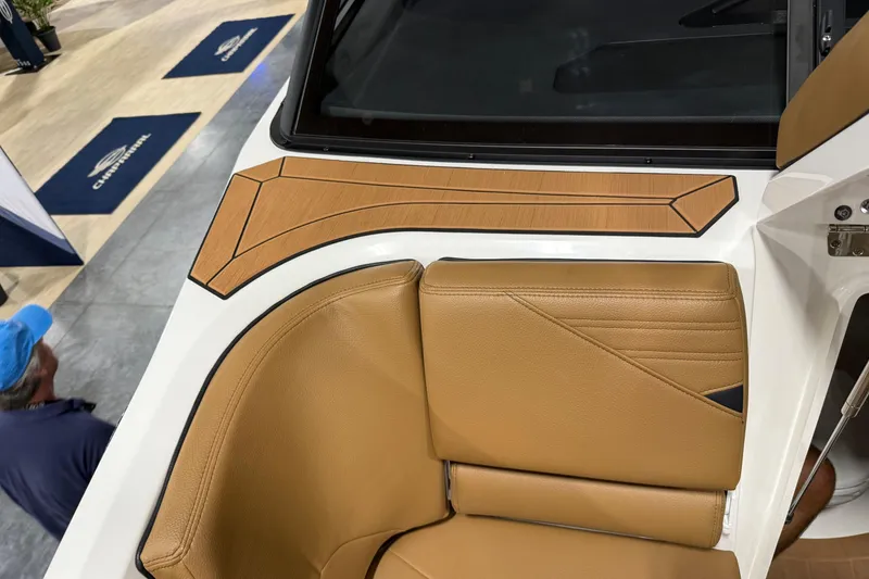 Slide: The Image of 2026 Yamaha Boats 295SD interior with tan leather seating and stylish design accents. - 16