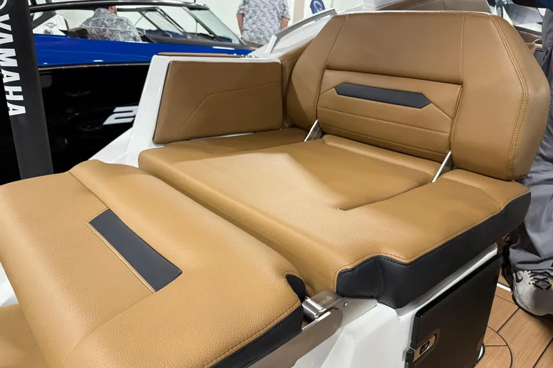 Slide: The Image of 2026 Yamaha Boats 295SD, luxurious tan seating detail, modern design. - 19