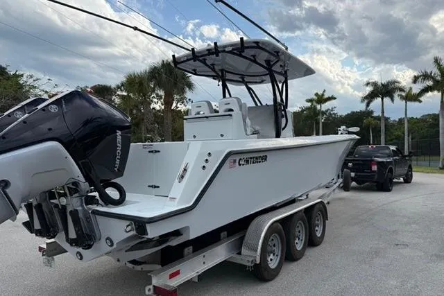 The Image of 2023 Contender 32 ST boat docked at marina, side view. - 0