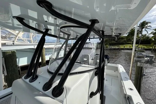 Slide: The Image of 2023 Contender 32 ST boat docked, featuring sleek design and sturdy construction. - 26