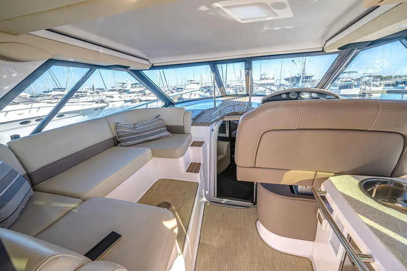 Slide: The Image of Luxurious interior of 2016 Regal 46 Sport Coupe yacht with marina view. - 13