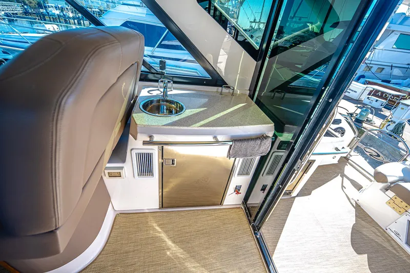 Slide: The Image of Interior of 2016 Regal 46 Sport Coupe yacht with sink and countertop. - 16