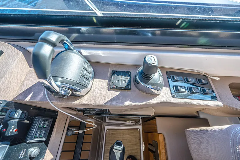 Slide: The Image of Control panel of 2016 Regal 46 Sport Coupe yacht with joystick and switches. - 20