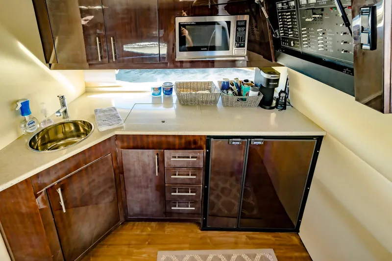 Slide: The Image of Luxurious galley kitchen in 2016 Regal 46 Sport Coupe yacht with modern amenities. - 22