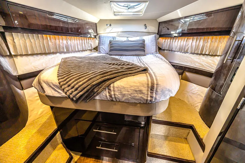 Slide: The Image of Luxurious bedroom interior of 2016 Regal 46 Sport Coupe yacht with elegant bedding. - 29