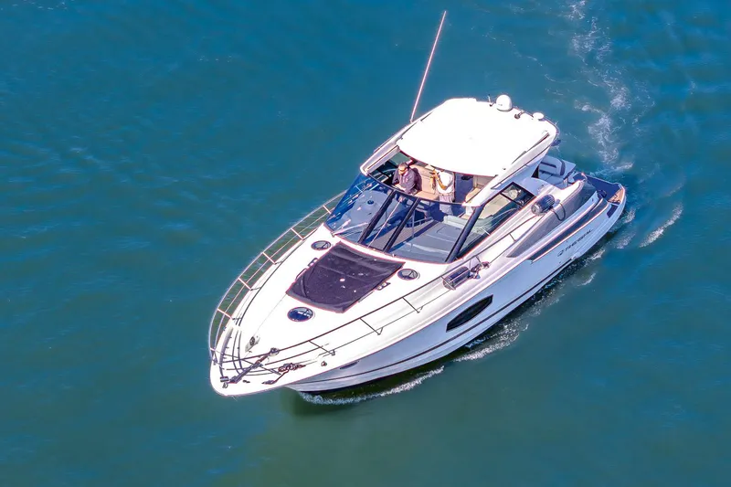 Slide: The Image of 2016 Regal 46 Sport Coupe cruising on open water, aerial view. - 3