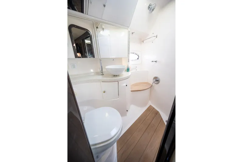 Slide: The Image of 2016 Regal 46 Sport Coupe bathroom with modern fixtures and wooden flooring. - 33