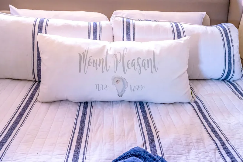 Slide: The Image of Luxurious bedding with striped pillows on a 2016 Regal 46 Sport Coupe yacht. - 37