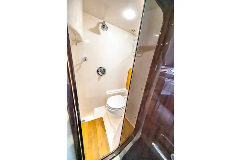 Slide: The Image of Bathroom interior of 2016 Regal 46 Sport Coupe yacht, featuring modern fixtures. - 38