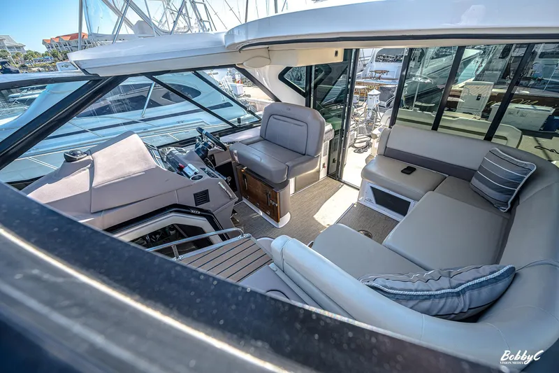 Slide: The Image of Luxurious interior of 2016 Regal 46 Sport Coupe yacht with plush seating and modern design. - 41