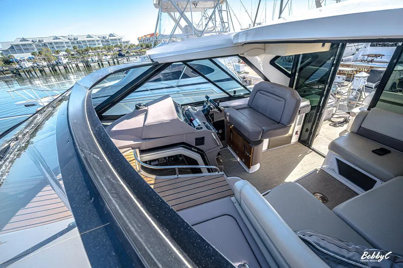 Slide: The Image of 2016 Regal 46 Sport Coupe yacht interior with luxurious seating and modern design. - 42