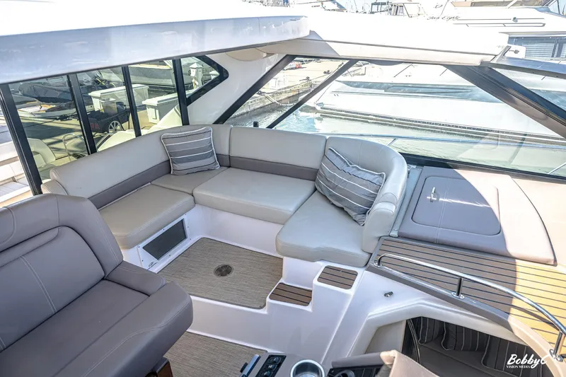 Slide: The Image of Luxurious seating area on a 2016 Regal 46 Sport Coupe yacht. - 43
