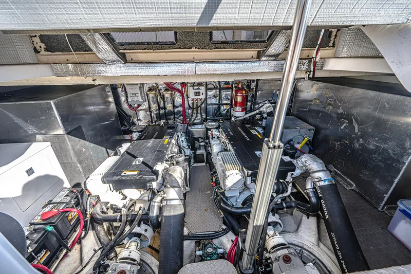 Slide: The Image of Engine room of a 2016 Regal 46 Sport Coupe with dual engines and equipment. - 44