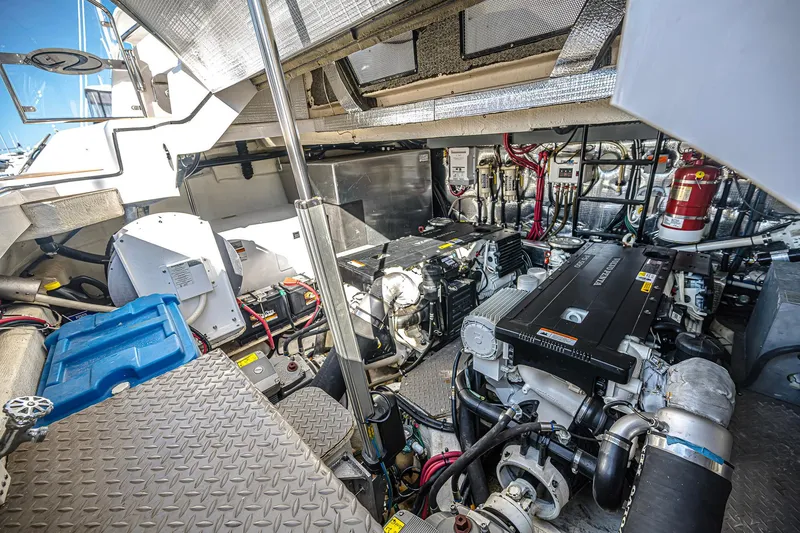 Slide: The Image of Engine room of 2016 Regal 46 Sport Coupe, showcasing mechanical components and systems. - 45