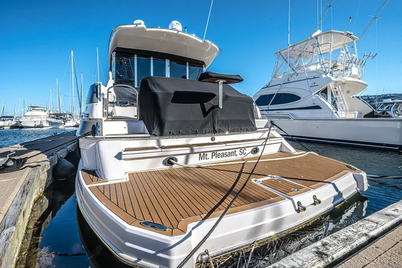 Slide: The Image of 2016 Regal 46 Sport Coupe yacht docked in Mt. Pleasant, SC marina. - 50