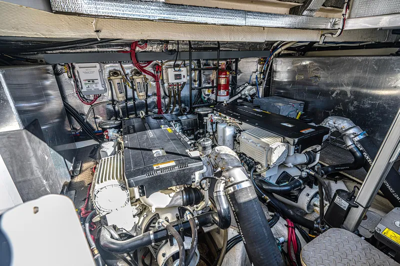 Slide: The Image of Engine room of 2016 Regal 46 Sport Coupe with dual engines and mechanical components. - 54