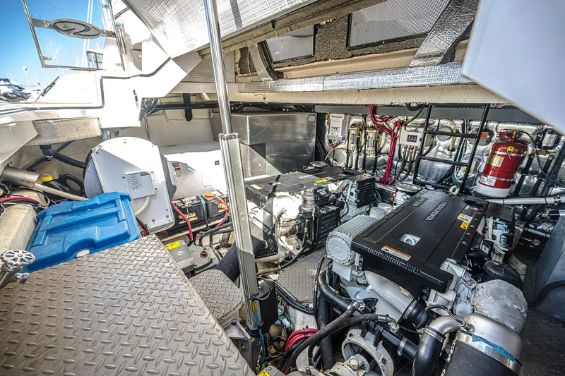 Slide: The Image of Engine room of 2016 Regal 46 Sport Coupe, showcasing mechanical components and systems. - 55