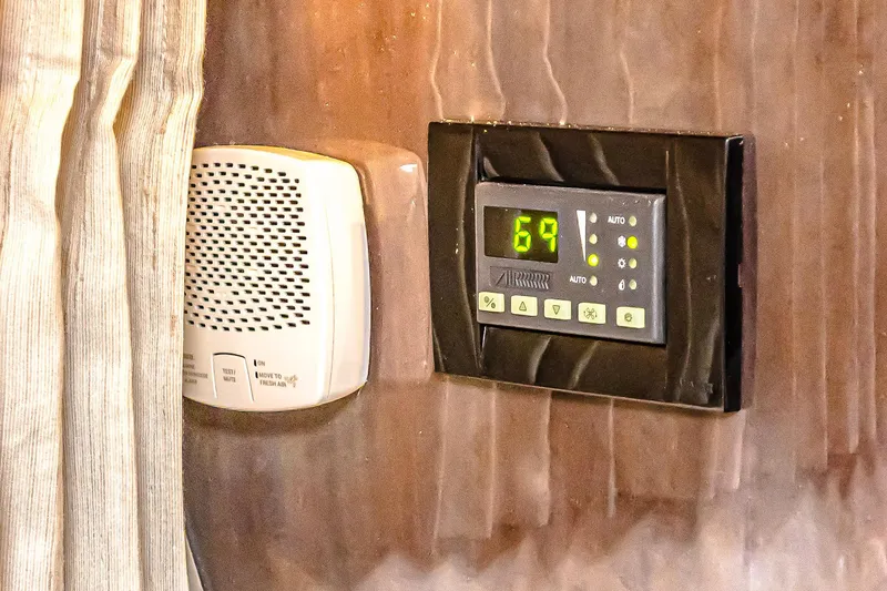 Slide: The Image of Thermostat and speaker on 2016 Regal 46 Sport Coupe interior wall. - 59