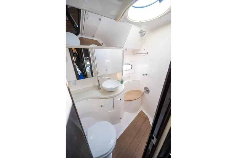 Slide: The Image of 2016 Regal 46 Sport Coupe bathroom with modern fixtures and wooden flooring. - 62