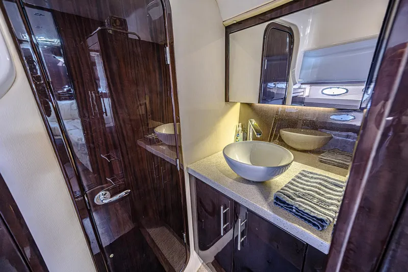 Slide: The Image of Luxurious bathroom in 2016 Regal 46 Sport Coupe yacht with modern sink and mirror. - 67
