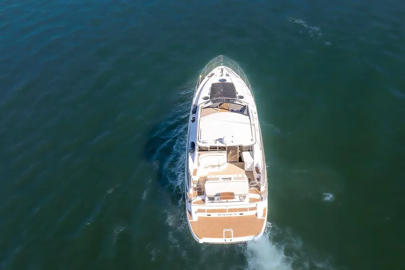 Slide: The Image of Aerial view of 2016 Regal 46 Sport Coupe yacht cruising on open water. - 7