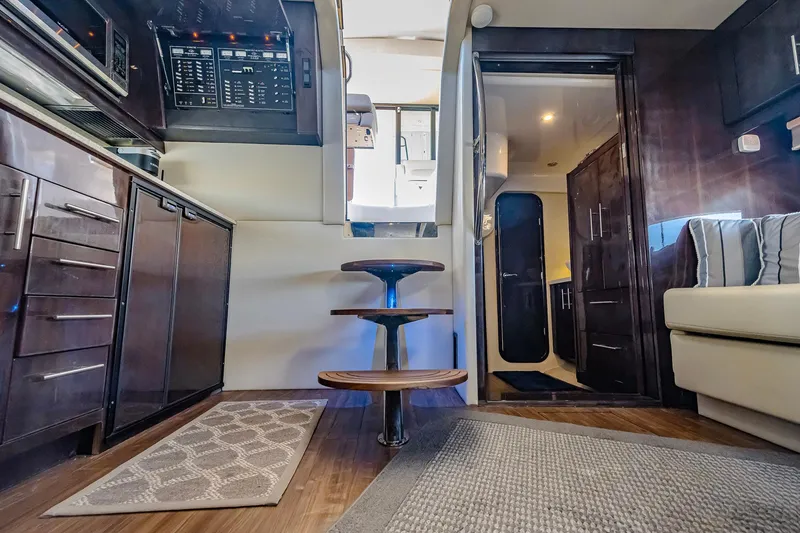 Slide: The Image of Interior of 2016 Regal 46 Sport Coupe yacht with modern design and wooden accents. - 71