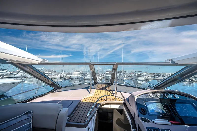 Slide: The Image of Interior view of 2016 Regal 46 Sport Coupe yacht at marina. - 80