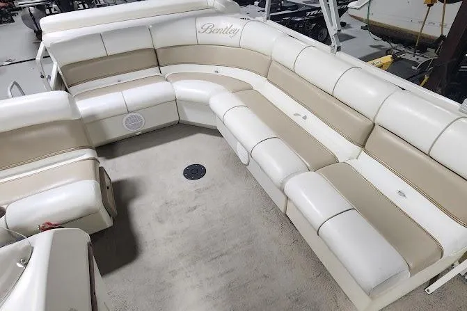 Slide: The Image of 2006 Bentley Pontoons 200/203 Cruise interior with beige and white seating arrangement. - 11
