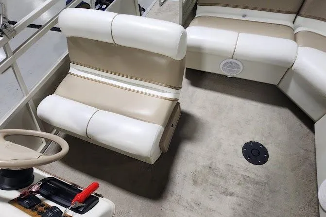 Slide: The Image of 2006 Bentley Pontoons 200/203 Cruise interior with beige and white seating. - 12