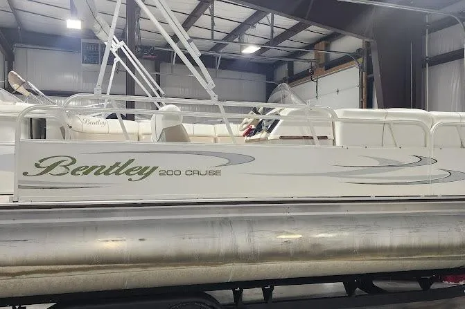 Slide: The Image of 2006 Bentley Pontoons 200/203 Cruise boat in indoor storage facility. - 3
