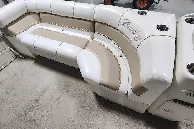 Slide: The Image of 2006 Bentley Pontoons 200/203 Cruise seating with beige and white upholstery. - 7