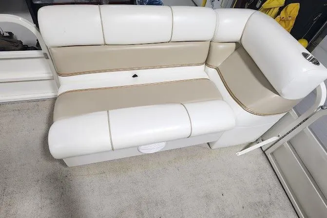 Slide: The Image of 2006 Bentley Pontoons 200/203 Cruise boat seating, white and beige upholstery, indoor setting. - 9