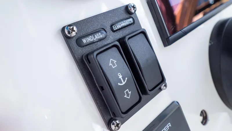 Slide: The Image of Control panel of 2018 Intrepid 430 Sport Yacht featuring windlass and anchor switches. - 17