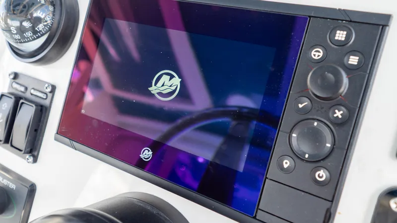 Slide: The Image of Control panel of a 2018 Intrepid 430 Sport Yacht with digital display and navigation controls. - 22