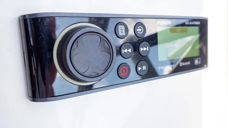 Slide: The Image of Control panel of a 2018 Intrepid 430 Sport Yacht with Fusion audio system. - 25