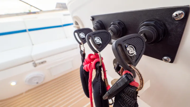 Slide: The Image of Keys hanging on a 2018 Intrepid 430 Sport Yacht, showcasing sleek design and functionality. - 26