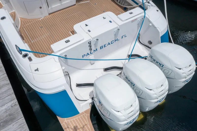 Slide: The Image of 2018 Intrepid 430 Sport Yacht with triple outboard engines, docked in Palm Beach, FL. - 33