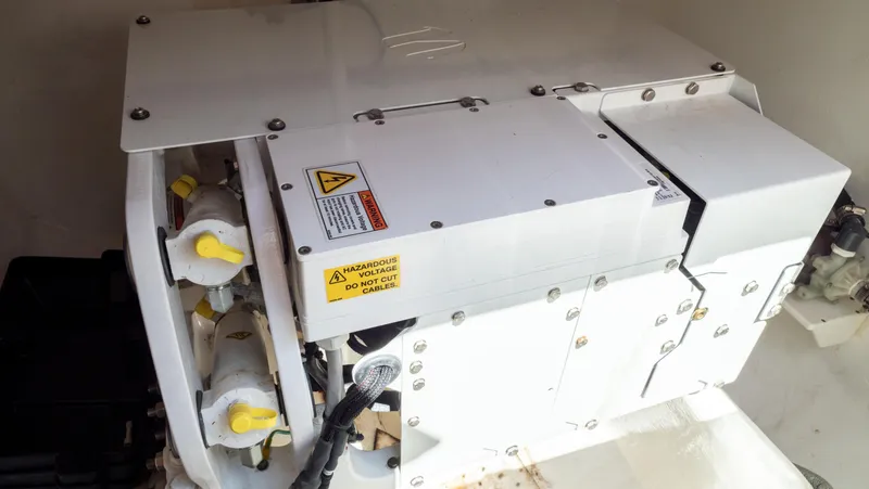 Slide: The Image of Engine compartment of a 2018 Intrepid 430 Sport Yacht, showcasing mechanical components. - 36