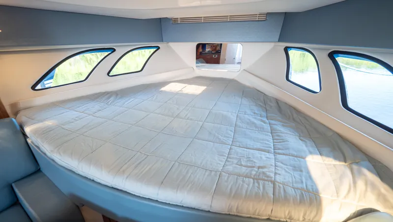 Slide: The Image of Luxurious cabin interior of 2018 Intrepid 430 Sport Yacht with large bed and windows. - 40